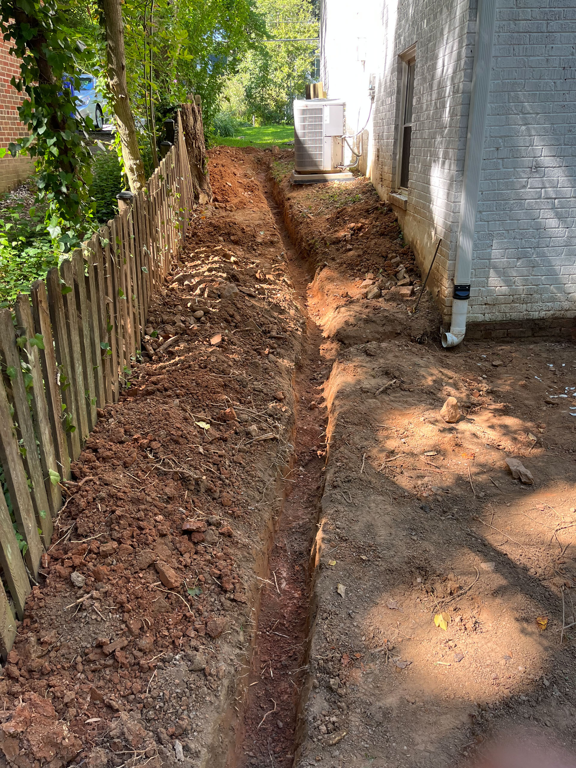 Resolving a drainage issue in a backyard in Kensington, MD.